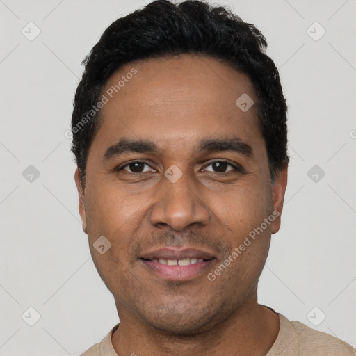 Joyful latino young-adult male with short  black hair and brown eyes