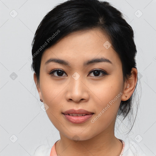 Joyful asian young-adult female with medium  black hair and brown eyes