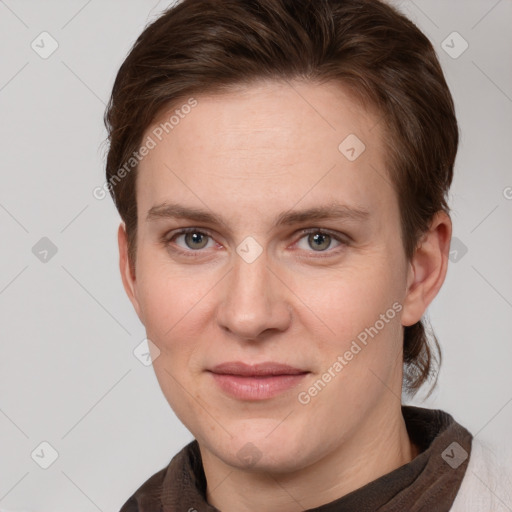 Joyful white young-adult female with short  brown hair and grey eyes