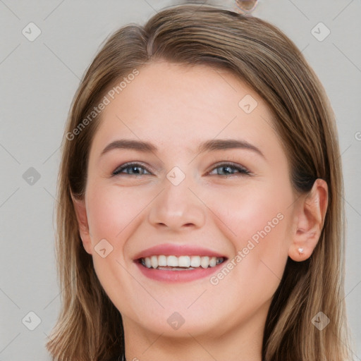 Joyful white young-adult female with long  brown hair and grey eyes