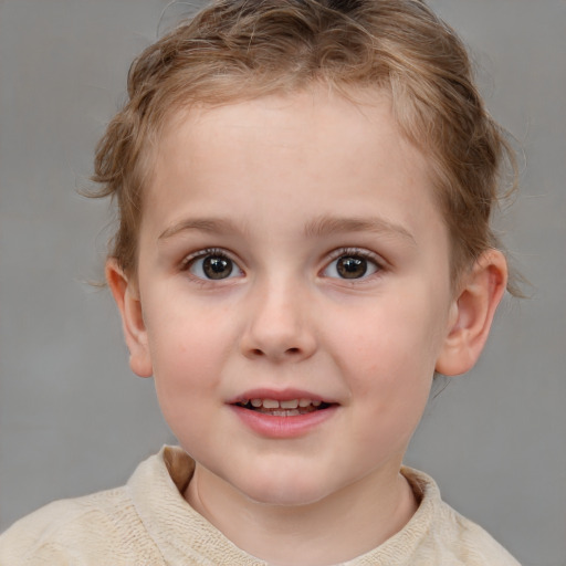 Joyful white child female with short  brown hair and grey eyes