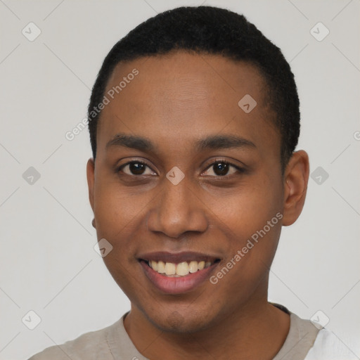 Joyful black young-adult male with short  brown hair and brown eyes