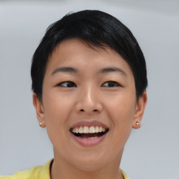 Joyful asian young-adult female with short  black hair and brown eyes