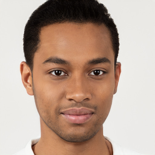 Joyful black young-adult male with short  brown hair and brown eyes