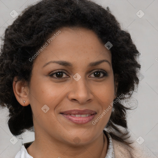 Joyful black adult female with medium  brown hair and brown eyes