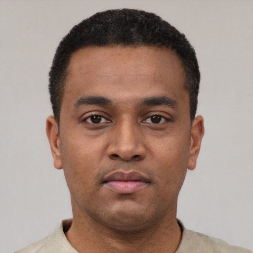 Neutral latino young-adult male with short  black hair and brown eyes
