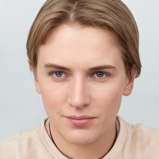 Joyful white young-adult female with short  brown hair and grey eyes