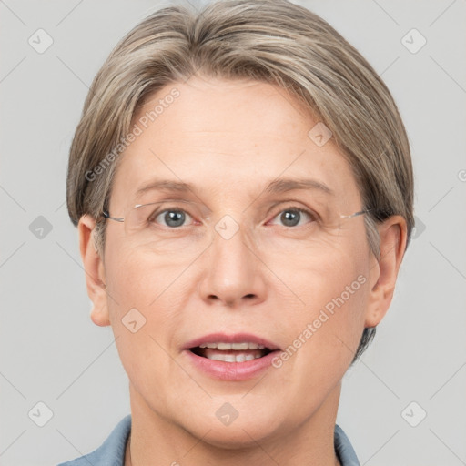 Joyful white adult female with short  brown hair and grey eyes