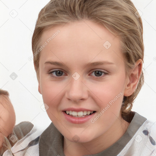 Joyful white child female with medium  brown hair and brown eyes