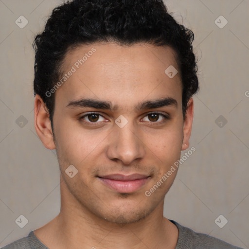 Joyful latino young-adult male with short  brown hair and brown eyes