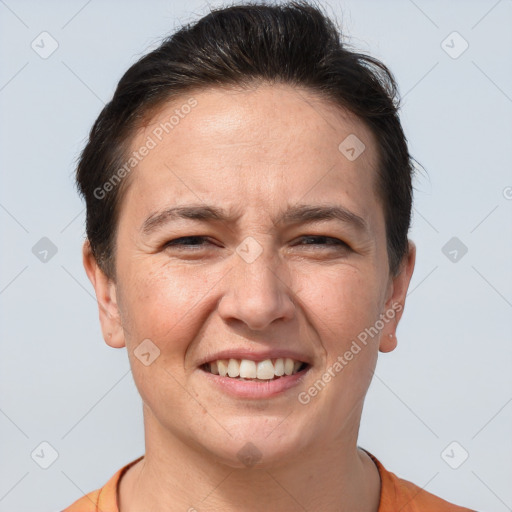 Joyful white adult female with short  brown hair and brown eyes