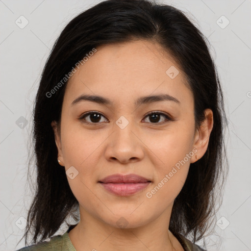 Joyful latino young-adult female with medium  brown hair and brown eyes