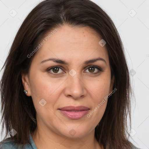 Joyful white adult female with long  brown hair and brown eyes