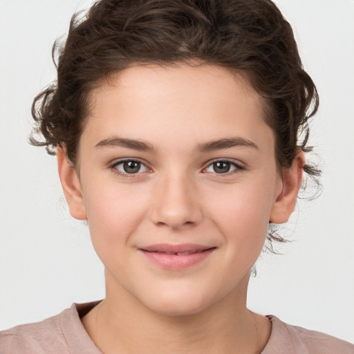 Joyful white child female with medium  brown hair and brown eyes