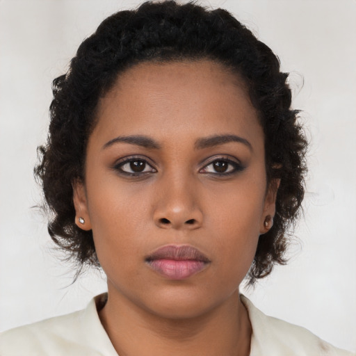 Neutral black young-adult female with long  brown hair and brown eyes