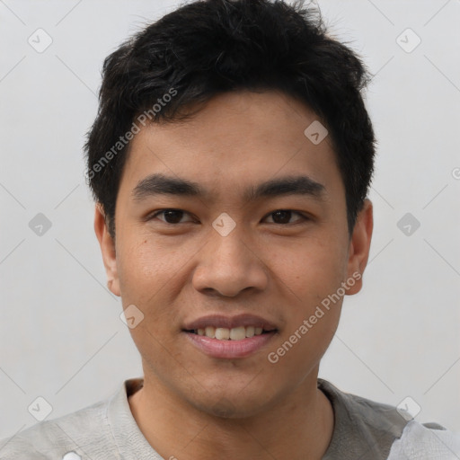 Joyful asian young-adult male with short  black hair and brown eyes