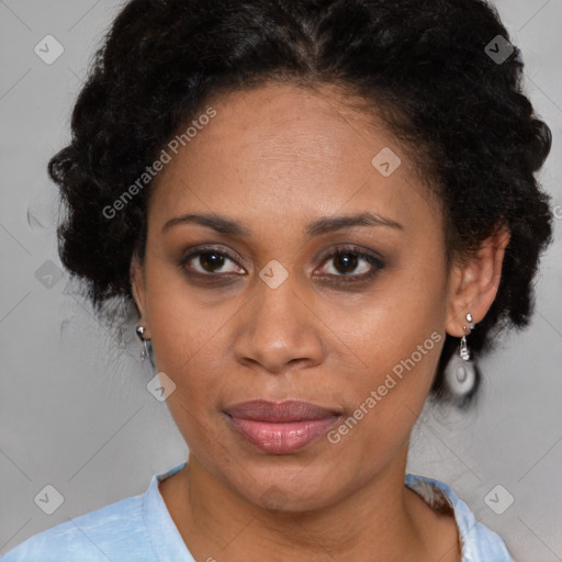 Joyful black adult female with short  brown hair and brown eyes