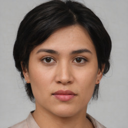 Neutral asian young-adult female with medium  black hair and brown eyes