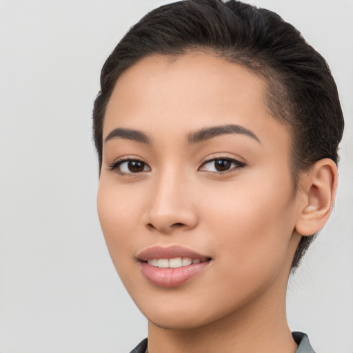 Joyful white young-adult female with long  brown hair and brown eyes