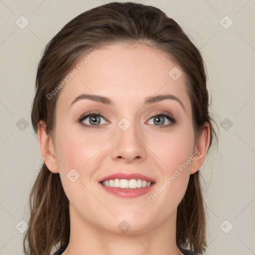 Joyful white young-adult female with medium  brown hair and green eyes