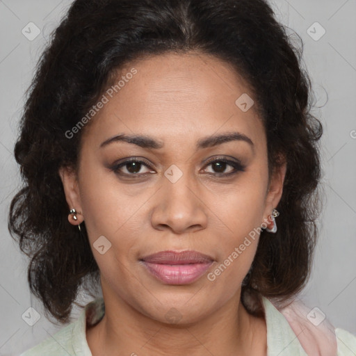 Joyful latino adult female with medium  brown hair and brown eyes