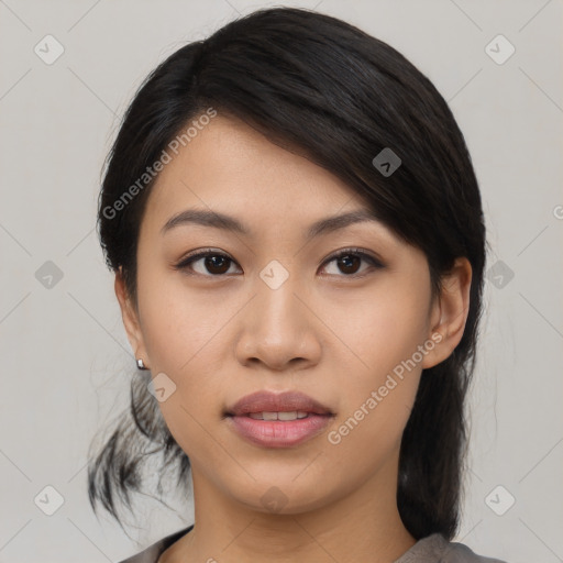 Joyful asian young-adult female with medium  black hair and brown eyes