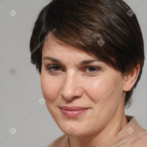 Joyful white adult female with medium  brown hair and brown eyes