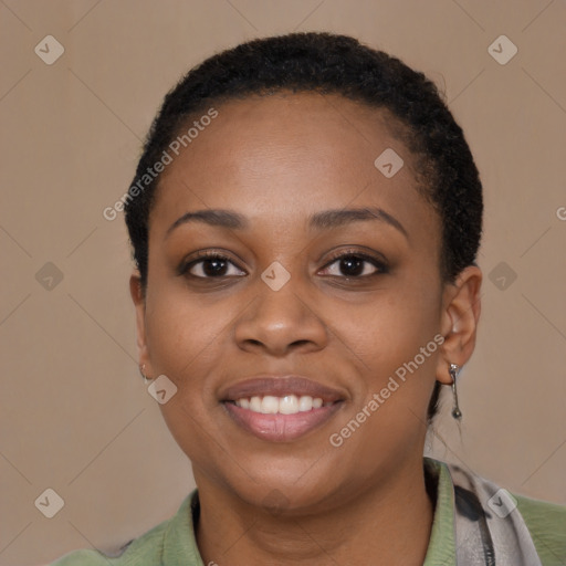 Joyful black young-adult female with short  black hair and brown eyes