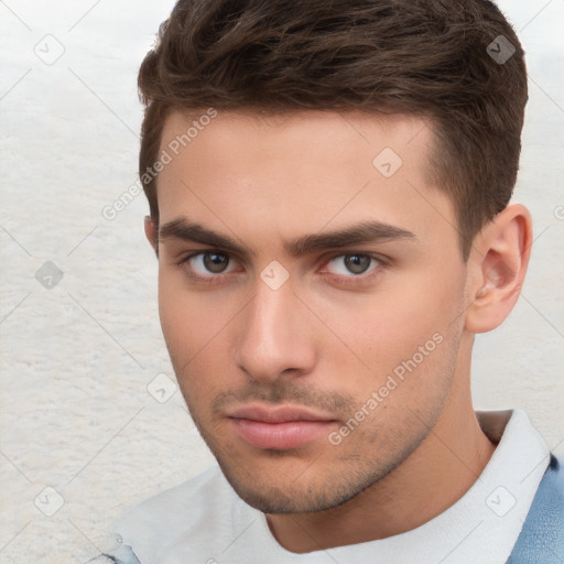 Neutral white young-adult male with short  brown hair and brown eyes