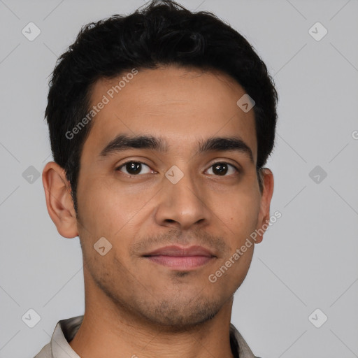 Joyful latino young-adult male with short  brown hair and brown eyes