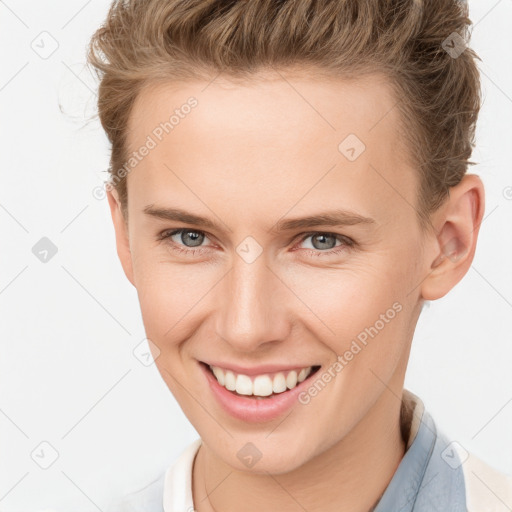 Joyful white young-adult female with short  brown hair and grey eyes