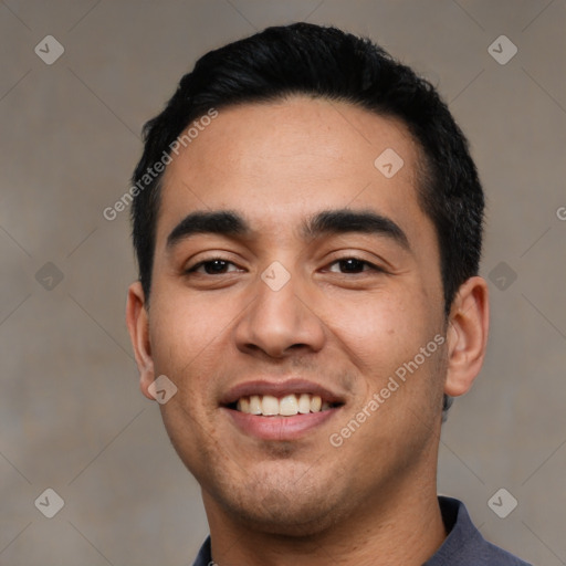 Joyful latino young-adult male with short  black hair and brown eyes