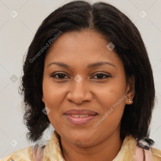 Joyful black adult female with medium  brown hair and brown eyes