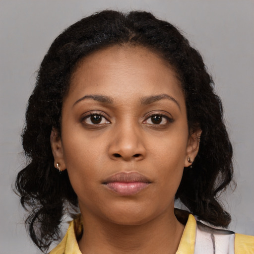 Neutral black young-adult female with medium  brown hair and brown eyes