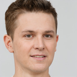 Joyful white adult male with short  brown hair and grey eyes