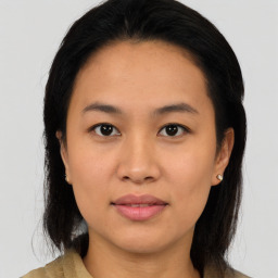 Joyful asian young-adult female with medium  black hair and brown eyes