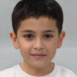 Joyful white child male with short  brown hair and brown eyes