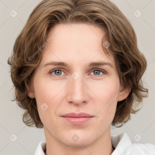 Joyful white young-adult female with medium  brown hair and green eyes