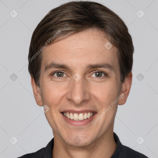 Joyful white adult male with short  brown hair and grey eyes