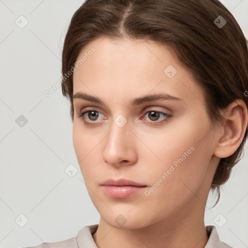 Neutral white young-adult female with short  brown hair and brown eyes