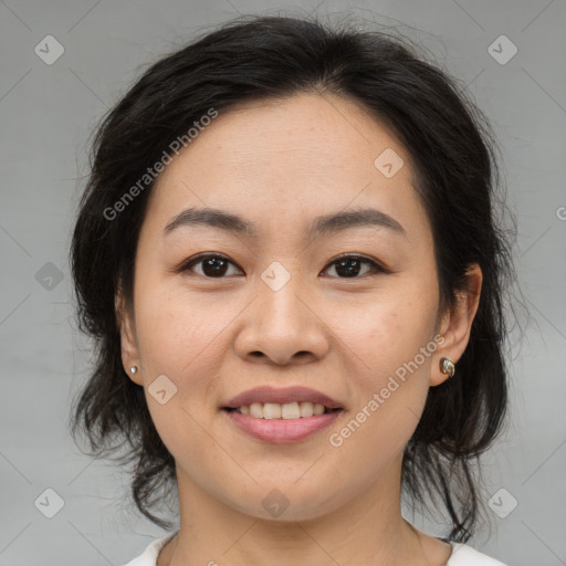 Joyful asian young-adult female with medium  brown hair and brown eyes