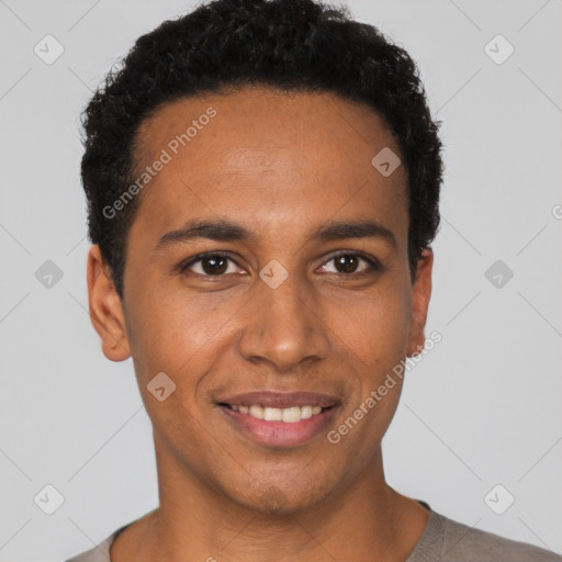 Joyful black young-adult male with short  black hair and brown eyes