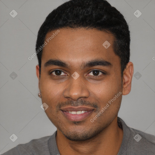 Joyful black young-adult male with short  black hair and brown eyes