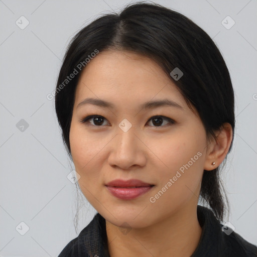 Joyful latino young-adult female with long  black hair and brown eyes