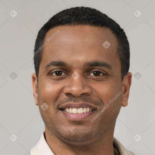Joyful latino young-adult male with short  black hair and brown eyes