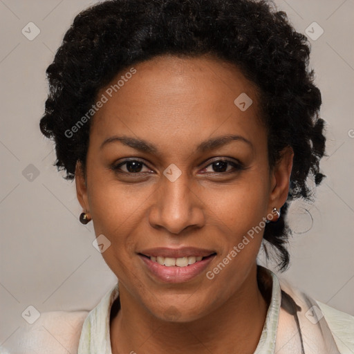 Joyful black adult female with short  brown hair and brown eyes