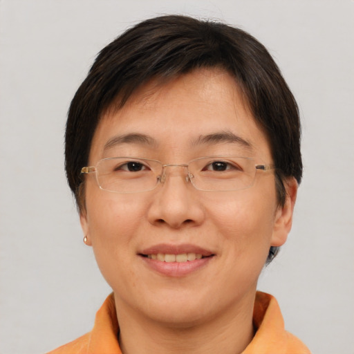 Joyful white adult female with short  brown hair and brown eyes