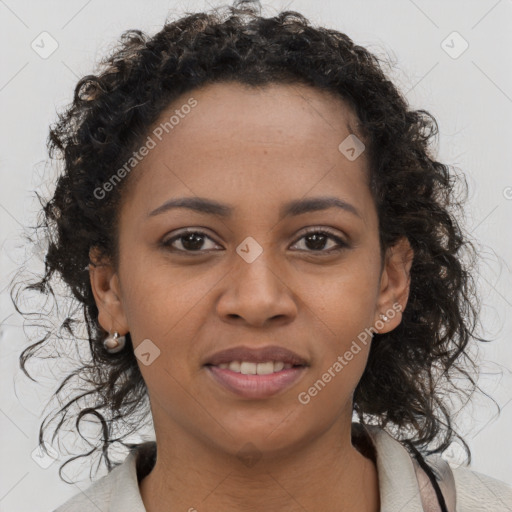 Joyful black young-adult female with medium  brown hair and brown eyes