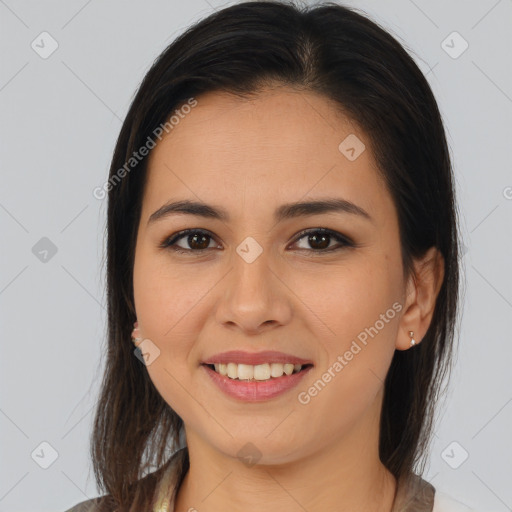 Joyful latino young-adult female with medium  brown hair and brown eyes