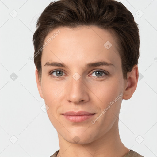 Joyful white young-adult female with short  brown hair and grey eyes